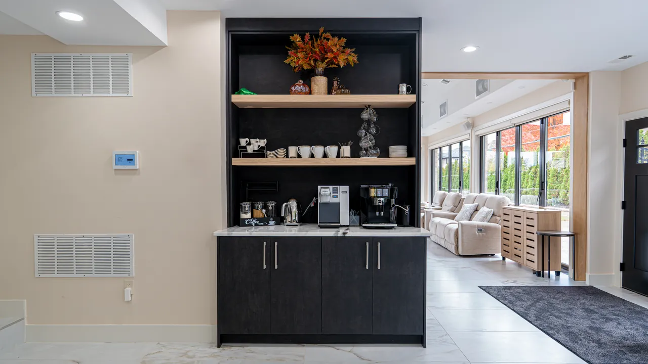 Coffee bar with black cabinets and open wood shelves by Mason Oak Carpentry in Detroit, MI