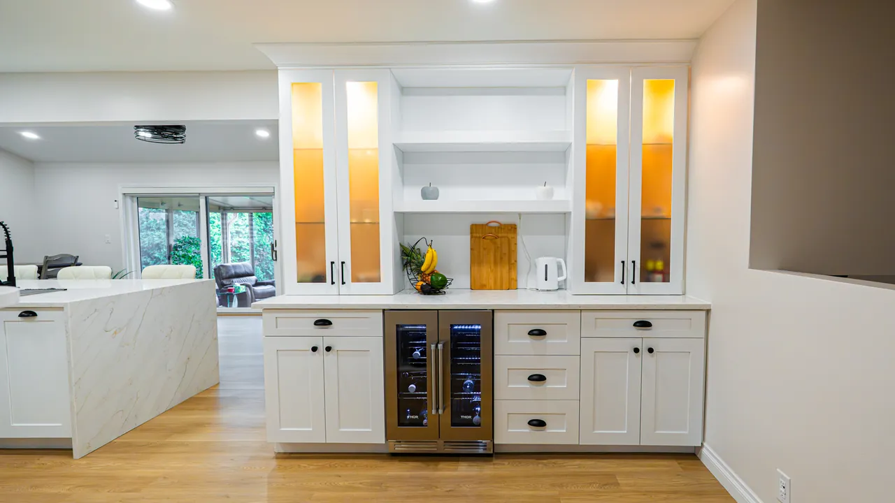 White hutch with lit glass cabinets, open shelves and a wine fridge by Mason Oak Carpentry in Detroit, MI