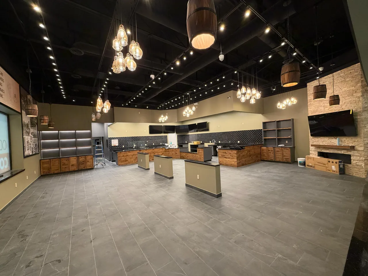 Commercial fit-out with wood service counters and wall shelving by Mason Oak Carpentry in Detroit, MI