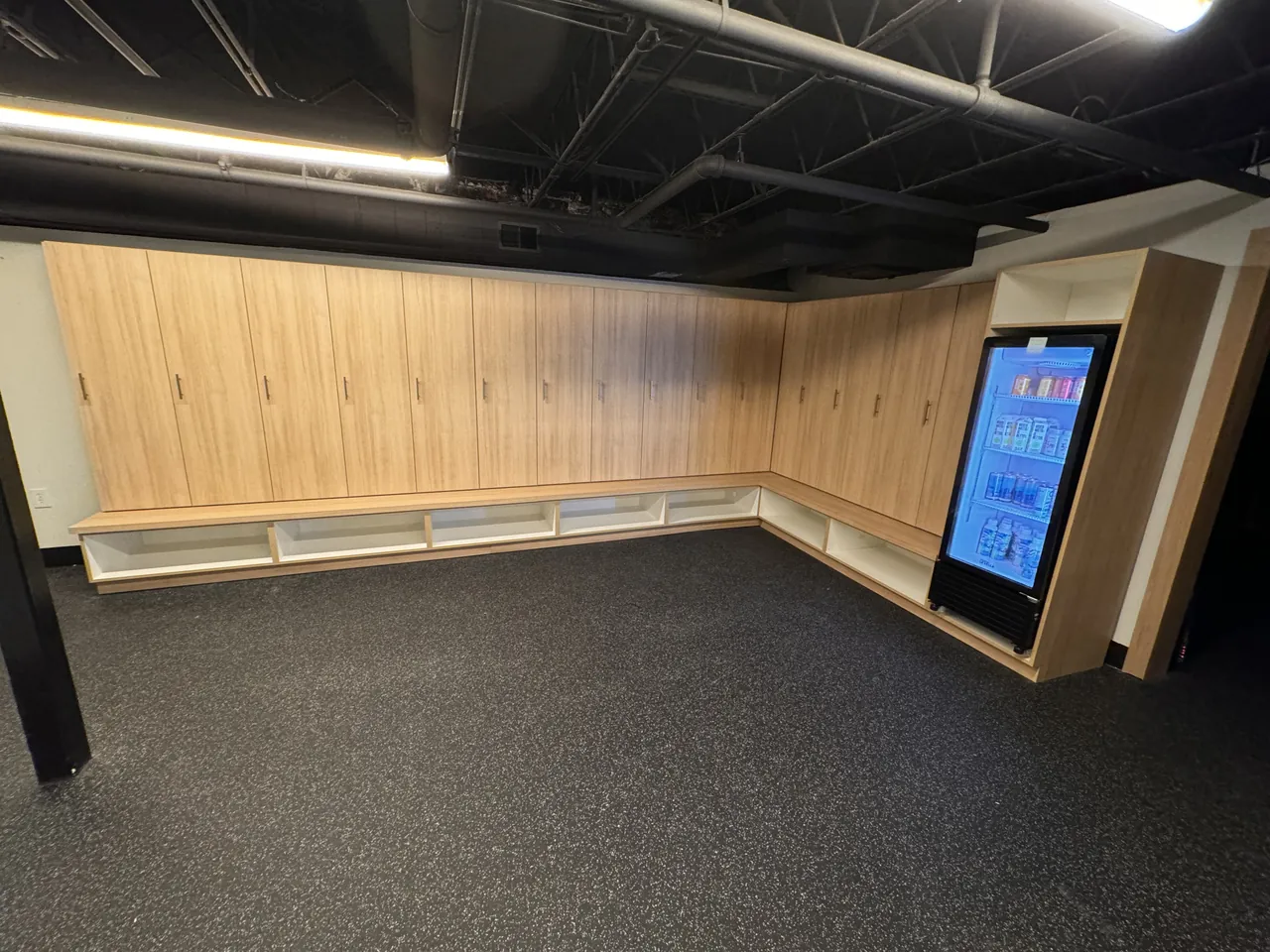 Wall of light wood lockers in a fitness space by Mason Oak Carpentry in Detroit, MI