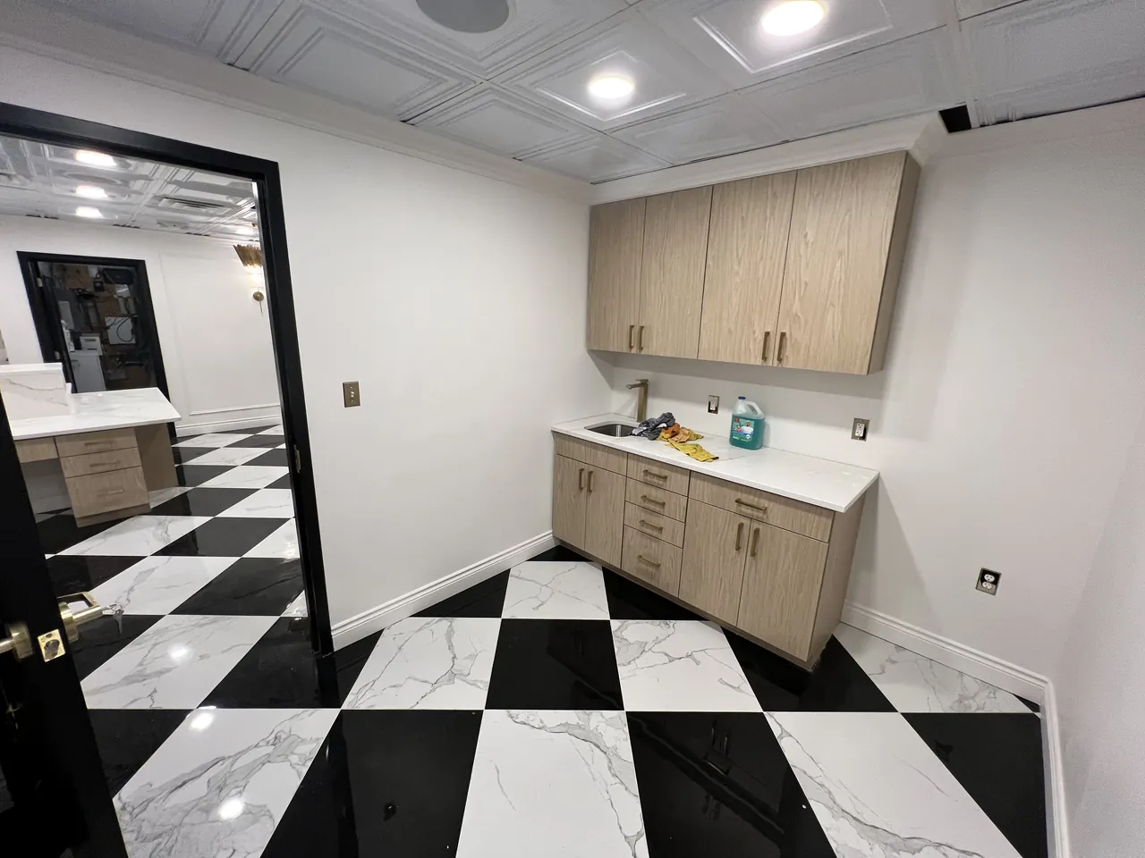Break room with light wood upper and base cabinets by Mason Oak Carpentry in Detroit, MI